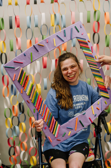 girl holding a frame for picture